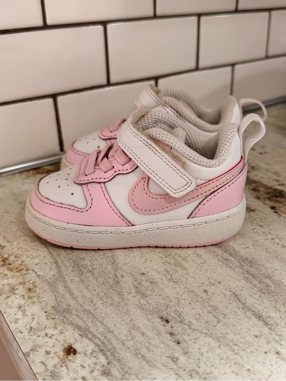 Kids Pink and White Nike shoes